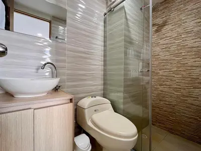 a bathroom with a toilet and a sink and a shower at Apartamento Aqua in Cartagena de Indias