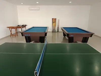 two ping pong tables in a room with a ping pong court at Apartamento en Los Morros - Cartagena de Indias in Cartagena de Indias