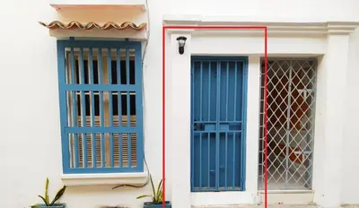 two blue doors on the side of a building at Apto Centro Historico Quero in Cartagena de Indias