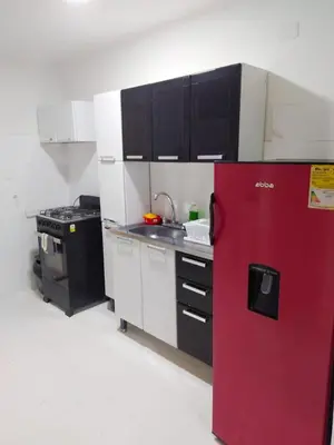 a kitchen with a red refrigerator and a stove at Apto Centro Historico Quero in Cartagena de Indias