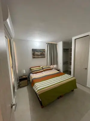 a bedroom with a large bed in a room at Apartamento Cartagena Serena del Mar - Capriella in Manzanillo del Mar