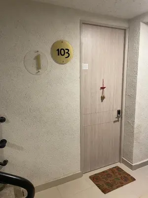 a door in a room with a clock on the wall at Apartamento Cartagena Serena del Mar - Capriella in Manzanillo del Mar