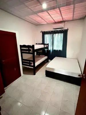 a bedroom with two bunk beds and a window at Casa Naty Crespo in Cartagena de Indias