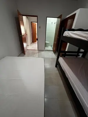 a room with two bunk beds and a mirror at Casa Naty Crespo in Cartagena de Indias