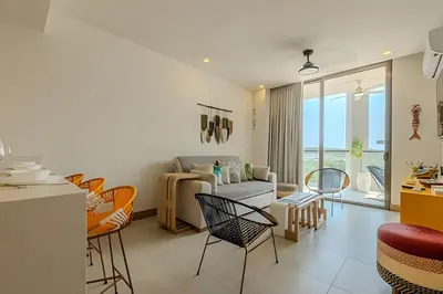 a living room with a couch and chairs at Lujoso con acceso directo a la Playa in Cartagena de Indias