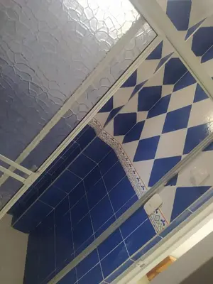 a blue and white checkered floor in a bathroom at Chalet Ledymar in Cartagena de Indias