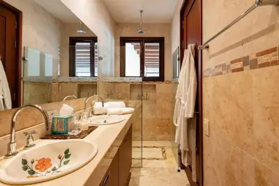 a bathroom with two sinks and a large mirror at Luxury Apartment Private Pool & Rooftop Jacuzzi in Cartagena de Indias