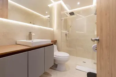 a bathroom with a toilet and a sink and a shower at Suite con daybed piso 16 y balcón panorámico CB1638 in Cartagena de Indias