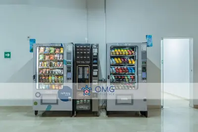 two vending machines are next to a wall at Suite con daybed piso 16 y balcón panorámico CB1638 in Cartagena de Indias