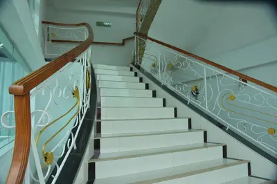 a stairway with white stairs with a blue and white railing at Hotel Cartagena Comfort in Cartagena de Indias