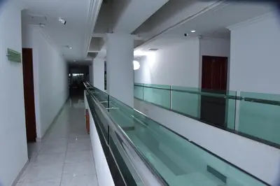 an empty hallway of a building with a glass floor at Hotel Cartagena Comfort in Cartagena de Indias