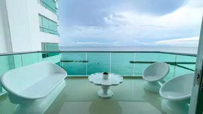 a bathroom with two toilets and a table on a balcony at Magico Apartamento Frente al Mar 4 Habitaciones BM83 in Coveñas