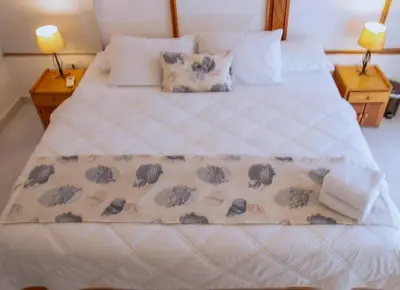 a bed with a blanket with elephants on it at Loft with view 7 rooms in Cartagena de Indias