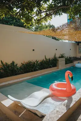 a red swan in a swimming pool at Almare Beach House Cartagena in Cartagena de Indias