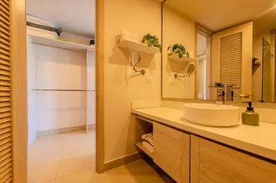 a bathroom with a sink and a mirror at Condominio frente al mar con acceso directo a la playa Morros IO in Cartagena de Indias