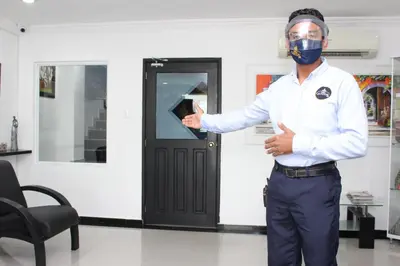 a man wearing a mask standing in a room at Ayenda 1315 Candiac in Barranquilla