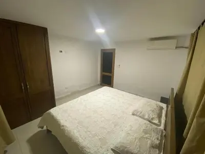 a bedroom with a white bed in a room at Casa Finca la Parcela in San Onofre