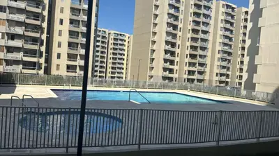 a swimming pool in the middle of two tall buildings at MY lOVE BARRANQUILLA 1 in Barranquilla