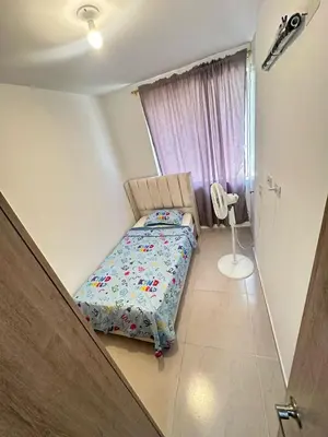 a small bedroom with a bed and a window at MY lOVE BARRANQUILLA 1 in Barranquilla