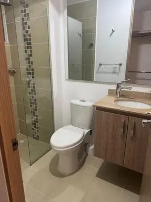 a bathroom with a toilet and a shower and a sink at MY lOVE BARRANQUILLA 1 in Barranquilla