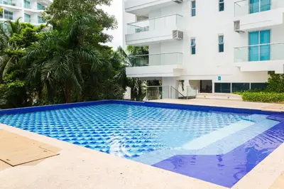 a swimming pool in front of a building at Apartamento 1 dormitorio Morros. Vista Mar y Salida Playa in Cartagena de Indias