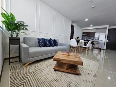 a living room with a couch and a table at Apartamento en el Hotel Estelar in Barranquilla
