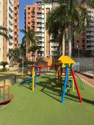 a playground with colorful play equipment in a park at Comfortable and Relaxing Apartment in Barranquilla
