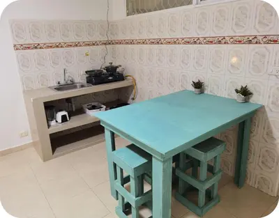 a blue table in a room with a sink at Apartamentos Santori in Cartagena de Indias