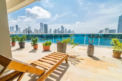 a balcony with a bench and a view of the city at Apartamento Unik Cartagena Edificio Poseidón in Cartagena de Indias