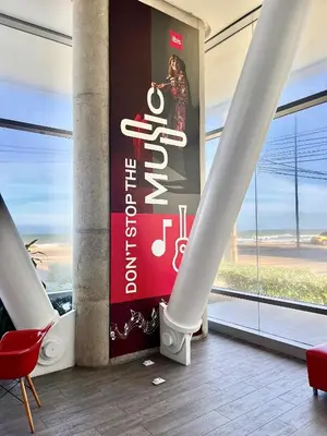 a lobby with a large sign in a building at ibis Cartagena Marbella in Cartagena de Indias