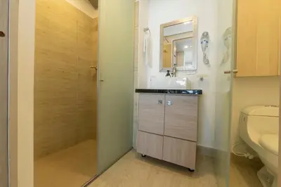 a bathroom with a sink and a shower at Sunset Oceanfront Studio in Cartagena de Indias