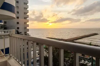 a view of the ocean from a balcony of a building at Oceanfront apartment in Cartagena in Cartagena de Indias
