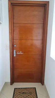 a wooden door in a room with a rug at Oceanfront apartment in Cartagena in Cartagena de Indias