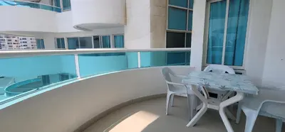 a balcony with a table and chairs on a building at Live Stay - Torres del Lago in Cartagena de Indias