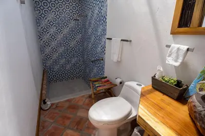 a bathroom with a toilet and a shower at Casa Origen Boutique en San Bernardo del Viento in San Bernardo del Viento