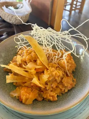 a plate of food with potato chips on a table at Casa Origen Boutique en San Bernardo del Viento in San Bernardo del Viento