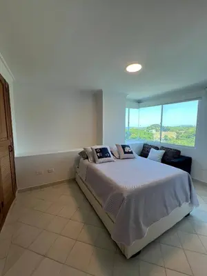 a bedroom with a large bed and a large window at Unwind in Santa Martas Oceanfront Retreat in Playa Dormida