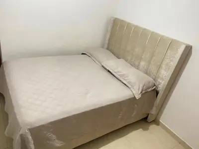 a small bed in a corner of a room at Habitación en Villa Carolina con aire in Barranquilla