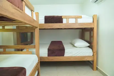 a room with two bunk beds in a room at Boquillas del Mar - Apartamentos in Cartagena de Indias