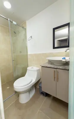 a bathroom with a toilet and a sink at Boquillas del Mar - Apartamentos in Cartagena de Indias