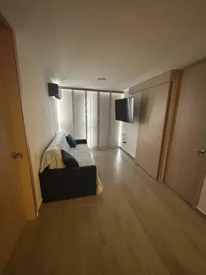 a room with a bed and a couch in a room at Moderno Apartamento en Barranquilla, Miramar in Barranquilla