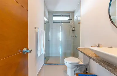 a bathroom with a shower and a toilet and a sink at Altamar, disfruta la mejor vista in Cartagena de Indias