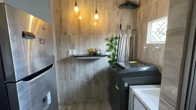 a small bathroom with a trash can and a sink at Apartamento Coveñas in Coveñas