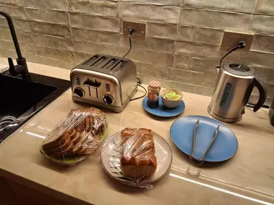 a counter with two slices of bread and a toaster at Terrazas Hotel Boutique in Cartagena de Indias