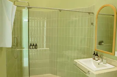 a bathroom with a glass shower and a sink at Terrazas Hotel Boutique in Cartagena de Indias