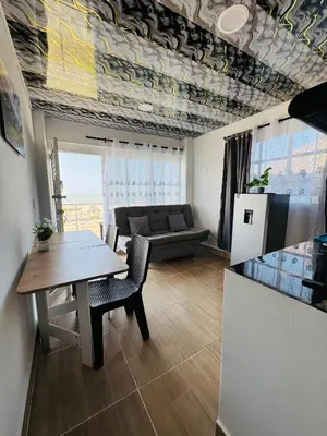 a living room with a table and a couch at Apartamentos el mochilero frente al mar piso 2 apto 3 in Cartagena de Indias