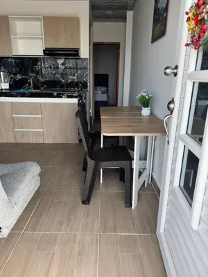 a kitchen and dining room with a table and chairs at Apartamentos el mochilero frente al mar piso 2 apto 3 in Cartagena de Indias