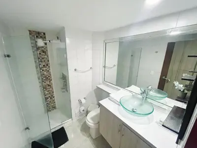a bathroom with a sink and a shower and a toilet at cartagena balcon con vista al mar in Cartagena de Indias