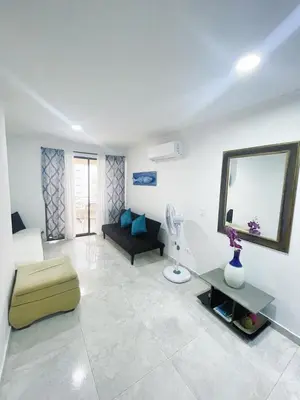 a living room with a couch and a table at cartagena balcon con vista al mar in Cartagena de Indias