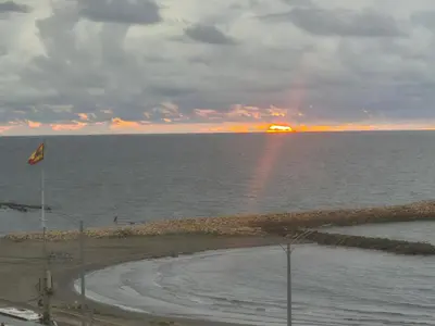a sunset over the ocean with a rainbow in the sky at cartagena balcon con vista al mar in Cartagena de Indias